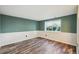 Spacious basement area featuring neutral walls and modern wood-look flooring at 68 N Quicksilver Ave, Castle Rock, CO 80104