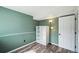 Cozy bedroom with a decorative floor lamp, and white shelving for storage at 68 N Quicksilver Ave, Castle Rock, CO 80104