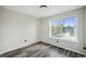 Bedroom with window, neutral walls, and modern wood-look flooring at 68 N Quicksilver Ave, Castle Rock, CO 80104
