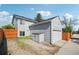 View of backyard featuring a shed, alley access and an attached garage at 68 N Quicksilver Ave, Castle Rock, CO 80104