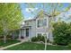 Charming two-story home with landscaped front yard and inviting entrance at 68 N Quicksilver Ave, Castle Rock, CO 80104