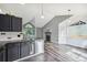 Bright kitchen featuring stainless steel appliances, tiled floor, and dark cabinets and countertops at 68 N Quicksilver Ave, Castle Rock, CO 80104