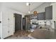 Well-equipped kitchen with stainless steel appliances, dark cabinetry, tile backsplash, and modern fixtures at 68 N Quicksilver Ave, Castle Rock, CO 80104
