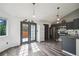 Modern kitchen with stainless steel appliances, ample cabinet space, and a view of the outdoor space at 68 N Quicksilver Ave, Castle Rock, CO 80104