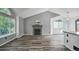 Spacious living room showcasing vaulted ceilings, fireplace, large windows, and hardwood floors at 68 N Quicksilver Ave, Castle Rock, CO 80104