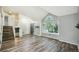 Open-concept living room with hardwood floors, vaulted ceilings, and abundant natural light through large windows at 68 N Quicksilver Ave, Castle Rock, CO 80104