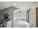 Sunlit living area with modern gray walls, tiled floors, large windows, and mountain decor at 68 N Quicksilver Ave, Castle Rock, CO 80104