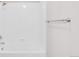All-white tiled bathtub with a shower head and a chrome towel rack on the wall at 186 S 45Th Ave, Brighton, CO 80601