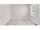 Well-lit bedroom featuring light wood floors and a large window at 186 S 45Th Ave, Brighton, CO 80601