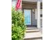 Inviting entryway features a vibrant blue door and clear house number signage at 186 S 45Th Ave, Brighton, CO 80601