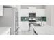Modern kitchen showcasing stainless steel appliances, white cabinetry, and granite countertops at 186 S 45Th Ave, Brighton, CO 80601