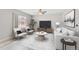 Inviting living area featuring plush seating, contemporary decor, and a ceiling fan at 186 S 45Th Ave, Brighton, CO 80601
