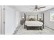 Comfortable main bedroom featuring a four-poster bed, stylish decor, and ample natural light at 186 S 45Th Ave, Brighton, CO 80601