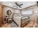 Cozy bedroom featuring natural light, an ensuite office and natural wood floors at 148 S Holman Way, Golden, CO 80401