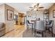 View of a dining room with hardwood floors, a table, and access to the kitchen at 148 S Holman Way, Golden, CO 80401