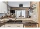 Close-up of kitchen with stainless steel appliances, granite countertops and modern faucet at 148 S Holman Way, Golden, CO 80401