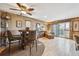 View of a living room with hardwood floors, a dining table, and access to the balcony at 148 S Holman Way, Golden, CO 80401