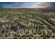 Expansive aerial view of a well-developed suburban neighborhood with mature trees and various roof styles at 12951 Vallejo Cir, Denver, CO 80234
