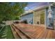 Backyard deck with plush seating, a grill and decorative string lights above the deck at 12951 Vallejo Cir, Denver, CO 80234