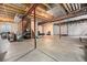 Unfinished basement with exposed wood and steel support beams creating a blank canvas for customization at 12951 Vallejo Cir, Denver, CO 80234