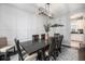 Elegant dining room boasts a modern light fixture and a stylish accent wall at 12951 Vallejo Cir, Denver, CO 80234