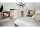 Comfortable main bedroom featuring a fireplace, and access to the en suite bathroom at 12951 Vallejo Cir, Denver, CO 80234