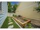 Landscaped garden with stone pathway and grass beside the home at 12951 Vallejo Cir, Denver, CO 80234