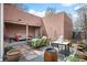 A stylish backyard patio area featuring comfortable seating, a built-in grill, and attractive landscaping at 469 Elati St, Denver, CO 80204