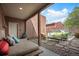A relaxing backyard patio with comfortable seating, tasteful decorations, and a shaded area for lounging at 469 Elati St, Denver, CO 80204