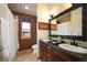 Well-lit bathroom featuring a double vanity, stylish decor, and a shower/tub combination, offering a blend of style and functionality at 469 Elati St, Denver, CO 80204