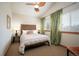 Well-lit bedroom featuring a ceiling fan, soft lighting, neutral colors creating a tranquil and relaxing retreat at 469 Elati St, Denver, CO 80204