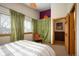 Cozy bedroom with large window, soft natural light, and simple decor creating a restful and inviting space at 469 Elati St, Denver, CO 80204