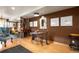 Cozy dining area featuring a round table, stylish chairs, and unique wall decor on hardwood floors at 469 Elati St, Denver, CO 80204