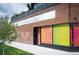 Exterior of a commercial building with vibrant artistic window displays at 469 Elati St, Denver, CO 80204