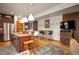 The kitchen is open and has stainless steel appliances and wood floors at 469 Elati St, Denver, CO 80204