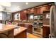 A kitchen that includes wooden cabinets, stainless steel appliances, and plenty of counter space at 469 Elati St, Denver, CO 80204