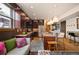 Open-concept kitchen with updated appliances, breakfast bar, and a cozy seating area for entertaining at 469 Elati St, Denver, CO 80204