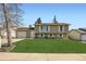Charming two-story home features a well-manicured lawn and inviting curb appeal at 2034 S Idalia St, Aurora, CO 80013