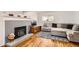 A comfortable living room features a decorative fireplace, TV and a large sectional sofa at 2034 S Idalia St, Aurora, CO 80013
