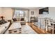 Bright living room boasts hardwood floors and neutral color palette at 2034 S Idalia St, Aurora, CO 80013