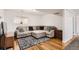 This relaxing living room features hardwood floors, a sectional sofa and neutral paint at 2034 S Idalia St, Aurora, CO 80013