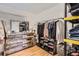 Walk-in closet featuring a wooden dresser and racks and shelves for storage at 2034 S Idalia St, Aurora, CO 80013
