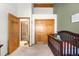 Neutral toned Bedroom with a closet and paneled doors leading to another room at 10180 Blue Sky Trl, Conifer, CO 80433