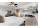 Bright main bedroom with a ceiling fan, and a large dresser at 10180 Blue Sky Trl, Conifer, CO 80433