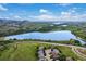 A panoramic view of the landscape with mountain views and a large lake in the distance at 10614 Kicking Horse Dr, Littleton, CO 80125