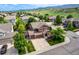 An aerial view of the property highlighting its well-manicured lawn and the surrounding neighborhood at 10614 Kicking Horse Dr, Littleton, CO 80125