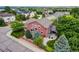 Aerial view of the home showcases its charming exterior, mature landscaping, and neighborhood setting at 10614 Kicking Horse Dr, Littleton, CO 80125