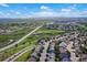Drone eye view of neighborhood featuring the home and a well-connected roadway at 10614 Kicking Horse Dr, Littleton, CO 80125