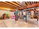 Unfinished basement with exposed beams and concrete flooring, with lots of potential at 10614 Kicking Horse Dr, Littleton, CO 80125