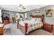 Spacious bedroom with dark gray walls, wood furniture, ceiling fan and rocker at 10614 Kicking Horse Dr, Littleton, CO 80125